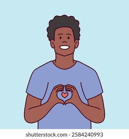 Cheerful young Black man with short curly hair making a heart gesture with his hands. Positive vibes.