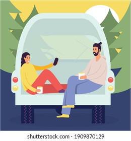 Cheerful Young Couple Enjoy Vacation Sitting In Rear Of Van, People In Camper Van, Picnic In The Forest In The House On Wheels