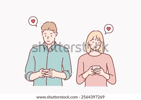 Cheerful young couple standing isolated over white background, holding smart phones in casual wear. Hand drawn style vector design illustrations.	