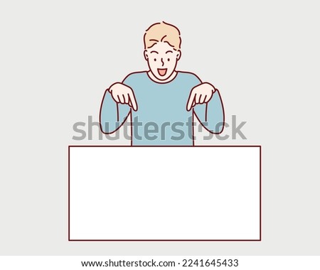 Cheerful Young  man Leaning And Pointing Down At Blank White Advertisement Board With Two Fingers.  Hand drawn style vector design illustrations.