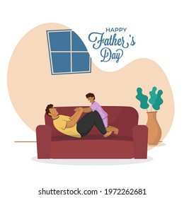 Cheerful Young Man Playing With His Son On Sofa For Happy Father's Day Concept.