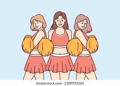 Cheerleader girls supporting sportsmen during match or tournament and entertaining fans in stadium. Beautiful teenage girls in college cheerleader clothes for football or basketball tournament