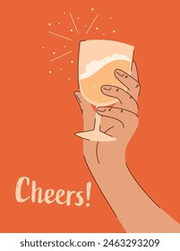 Cheers written on a champagne glass held by a hand