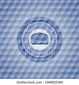 cheeseburger icon inside blue badge with geometric pattern background.