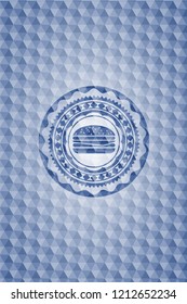 cheeseburger icon inside blue emblem with geometric background.