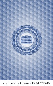 cheeseburger icon inside blue emblem or badge with geometric pattern background.