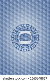 cheeseburger icon inside blue emblem with geometric background.