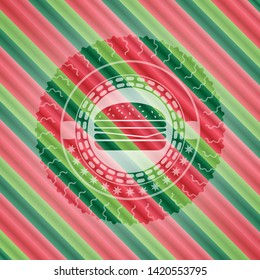 cheeseburger icon inside christmas emblem.