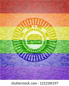 cheeseburger icon inside emblem on mosaic background with the colors of the LGBT flag
