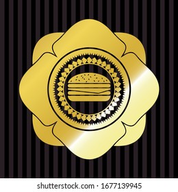 icono del cheeseburger dentro del emblema o placa de oro
