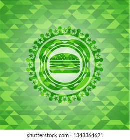 cheeseburger icon inside green mosaic emblem