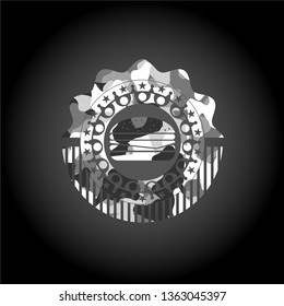 cheeseburger icon inside grey camouflaged emblem