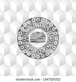 cheeseburger icon inside grey emblem with cube white background
