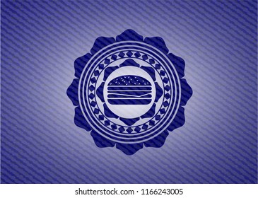 cheeseburger icon inside jean or denim emblem or badge background