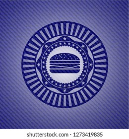 cheeseburger icon inside jean or denim emblem or badge background