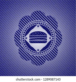 cheeseburger icon inside jean or denim emblem or badge background