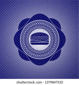 cheeseburger icon inside jean or denim emblem or badge background