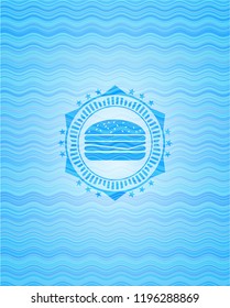 cheeseburger icon inside light blue water badge background.