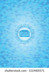cheeseburger icon inside light blue emblem with mosaic ecological style background