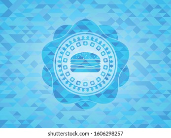 cheeseburger icon inside light blue emblem with triangle mosaic background