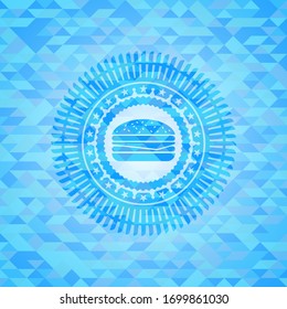 cheeseburger icon inside light blue emblem with mosaic ecological style background