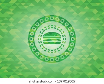 cheeseburger icon inside realistic green mosaic emblem