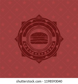 cheeseburger icon inside red emblem