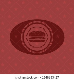 cheeseburger icon inside red emblem
