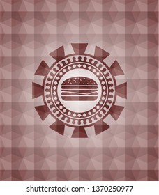 cheeseburger icon inside red seamless badge with geometric background.
