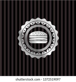 cheeseburger icon inside silver emblem