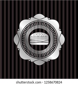 cheeseburger icon inside silvery emblem