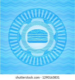 cheeseburger icon inside sky blue water emblem.