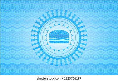 cheeseburger icon inside water concept badge background.