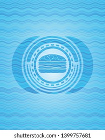 cheeseburger icon inside water emblem.