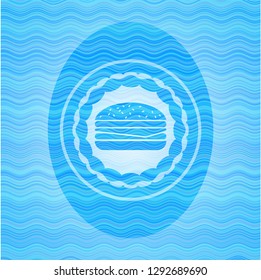 cheeseburger icon inside water representation badge background.