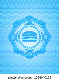 cheeseburger icon inside water representation badge.