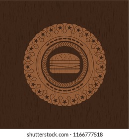 cheeseburger icon inside wood emblem. Retro