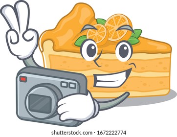 Cheesecake orange mascot design as a professional photographer with a camera