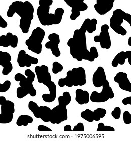 Cheetah or leopard animal print in black and white. Seamless pattern of spots and dots. Wildlife jungle or savannah motif or theme. Exotic texture or textile, wallpaper. Vector in flat style