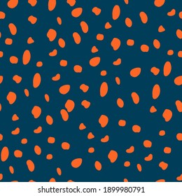 Cheetah seamless vector print. Orange spots on blue background. Repeating pattern.