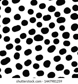 Cheetah skin seamless pattern, black specks on a white background.