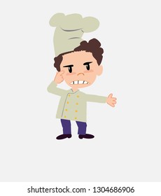 Chef , is angry and points his head with his index finger.