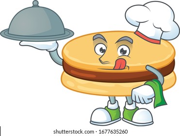 chef cartoon character of brown alfajor with food on tray