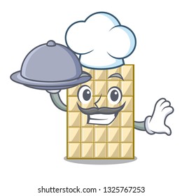 Chef with food white chocolate on mascot wood table