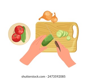 Chef hand chopping fresh cucumber on cutting board for salad with tomatoes and onion view from above