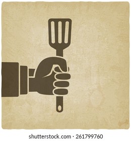 chef hand with turner old background - vector illustration. eps 10