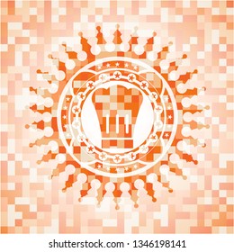 chef hat icon inside abstract orange mosaic emblem
