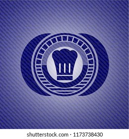 chef hat icon inside badge with denim texture