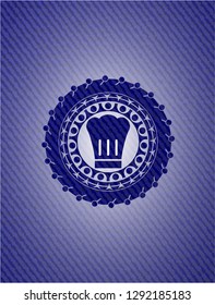 chef hat icon inside badge with jean texture