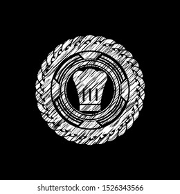 chef hat icon inside chalk emblem written on a blackboard